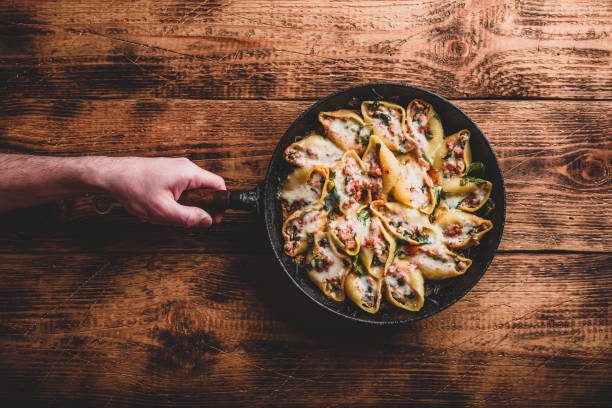 istock Skillet of stuffed jumbo shells pasta 1208693599