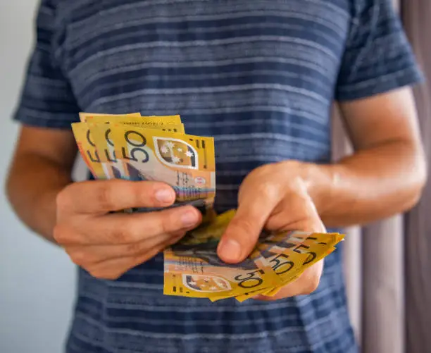 Man handling fifty dollar notes finance. Money and bills economy