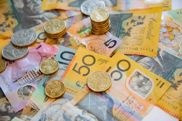 australian notes and coins spilled out. - ações de bolsa imagens e fotografias de stock