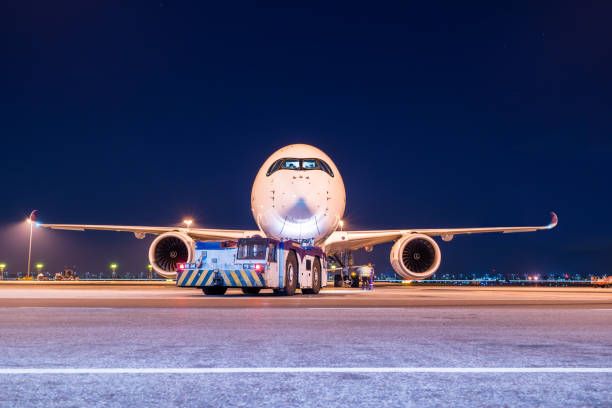 istock aircraft with push back truck 1208699138