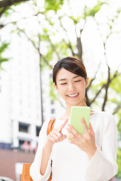 istock asian woman who see a smart phone 1208699430