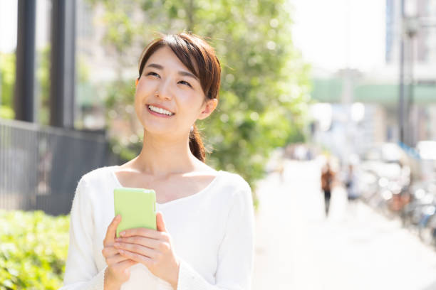 istock asian woman who see a smart phone 1208699433
