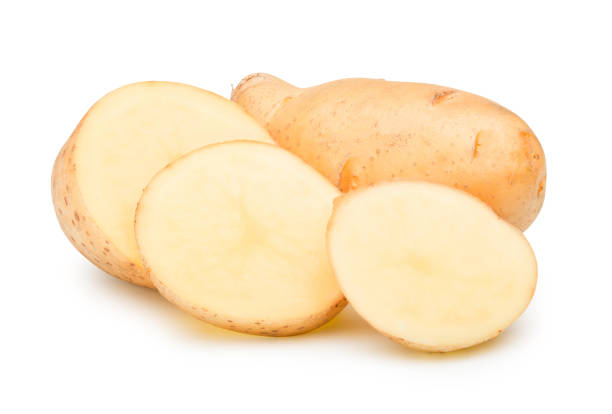 istock Raw potato sliced into pieces on white with clipping path. 1208702956