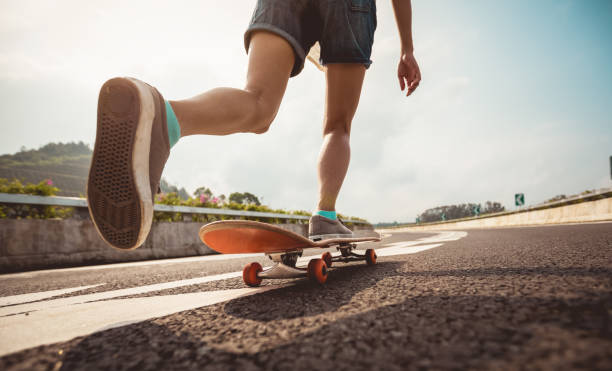 istock Skateboarder skateboarding  on highway road 1208703258