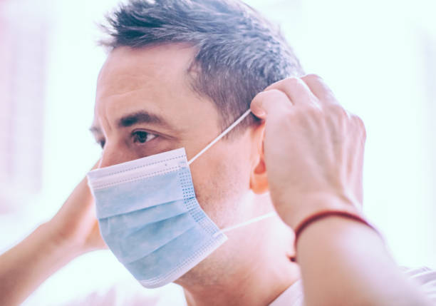 istock Man wearing a face mask during coronavirus outbreak 1208704256