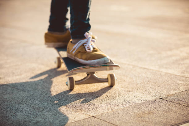 istock Skateboarder skateboarding at sunrise park 1208705061