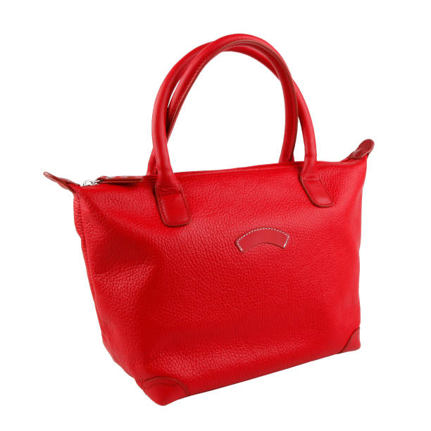 istock Female red leather handbag isolated on white 1208712896