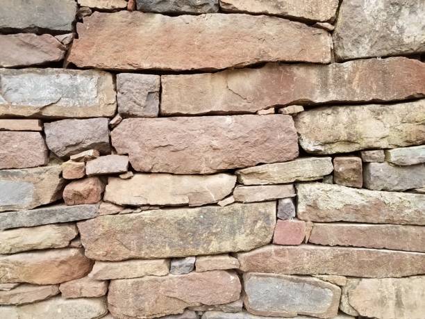 istock grey and red stone or brick wall or background 1208714218