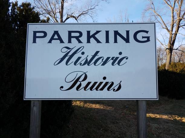 istock white parking historic ruins sign with trees 1208714219
