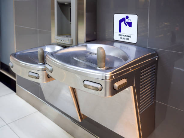 Drinking fountain water free service for traveller in airport. Drinking fountain water free service for traveller in airport. Stainless steel automatic drinking fountain water machine. drinking fountain stock pictures, royalty-free photos & images