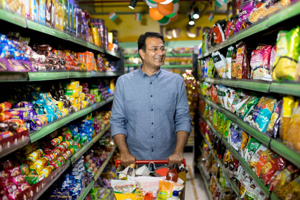 istock Happy man shopping at supermarket 1208715010