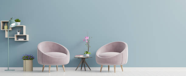 istock The interior has a pink armchair on empty blue wall background. 1208716271