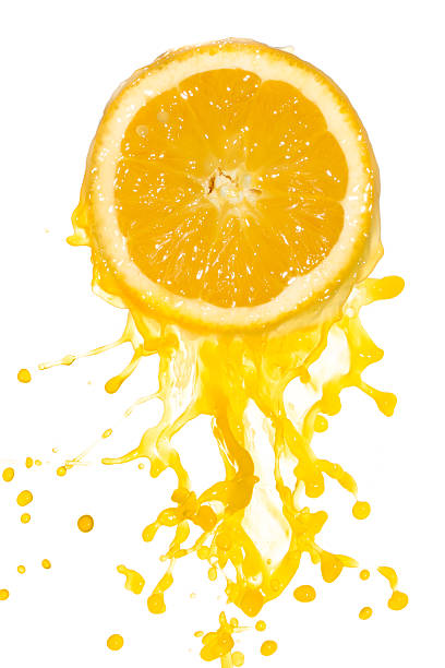 istock Side view of half orange being squeezed juice coming out 120871736
