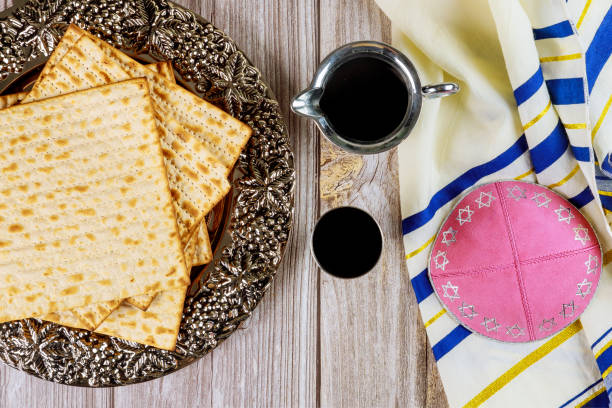 istock Matza, tallit and kosher kiddush on wooden background. 1208718071