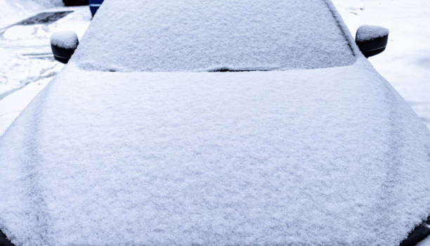 istock Front View of Car Covered in Snow 1208719898