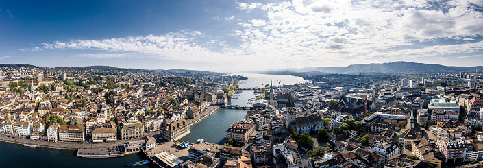 aerial view of Zurich city with famous travel destinations St. Peter's Church clock tower, Fraumunster and Grossmunster by the Limmat River, Zurich old town.