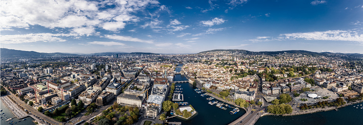 aerial view of Zurich city with famous travel destinations St. Peter's Church clock tower, Fraumunster and Grossmunster by the Limmat River, Zurich old town.