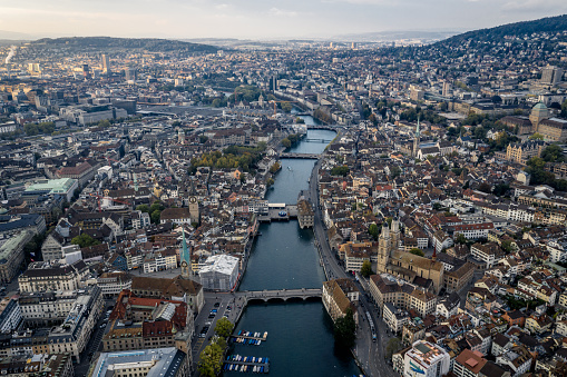 aerial view of Zurich city with famous traveSt. Peter's Church clock tower, Fraumunster and Grossmunster by the Limmat River, Zurich old town.