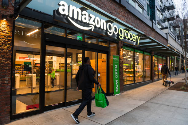 Amazon Grocery Seattle, USA - Feb 25, 2020: People visiting the first day of the Amazon Go cashier less grocery store late in the day on Capitol Hill. self checkout photos stock pictures, royalty-free photos & images