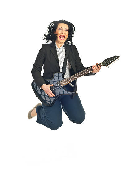 istock Cheerful woman with guitar jumping 120872793