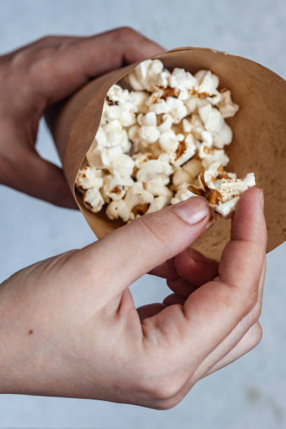 istock A paper cone full of popcorn 1208733793