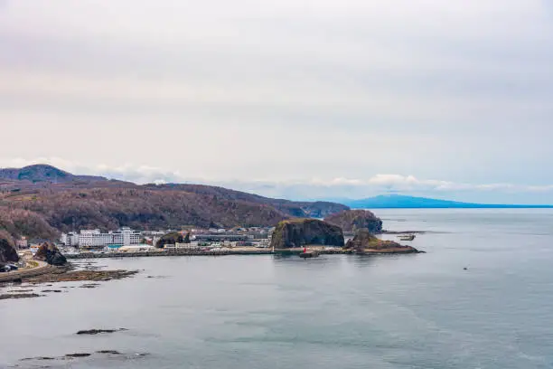 Photo of View of Utoro fishing port in springtime. Hokkaido, Japan