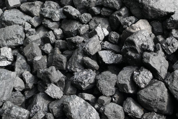 istock Pile of natural black hard coal or diamond coal background 1208734791