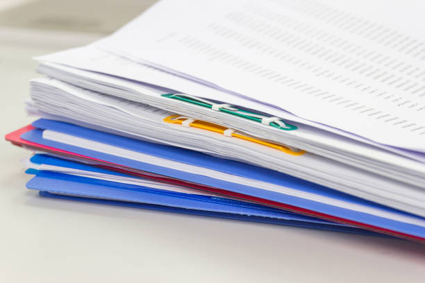 file folder and Stack of business report paper file on the table in a work office, concept document in work office
