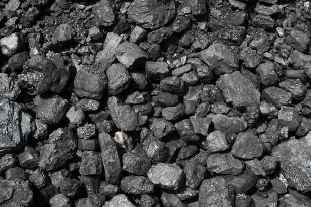 istock Pile of natural black hard coal or diamond coal background 1208736434