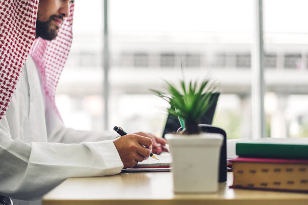 istock Arabic businessman working with laptop computer.creative arab business people planning at modern work loft 1208738348