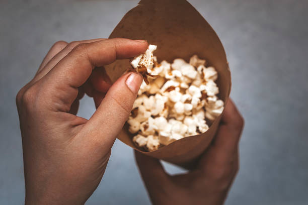 istock A paper cone full of popcorn 1208738876