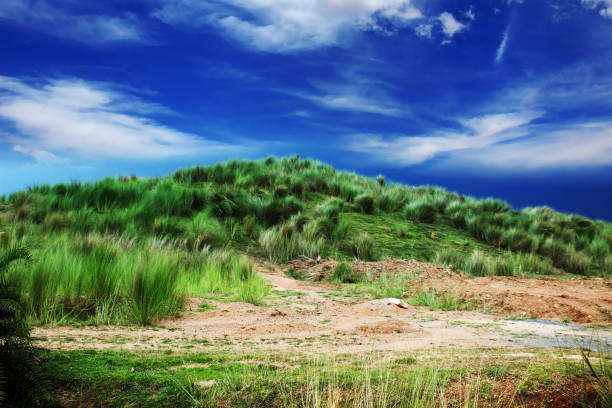 small grass mountain with colorful cloud sky beautiful nature