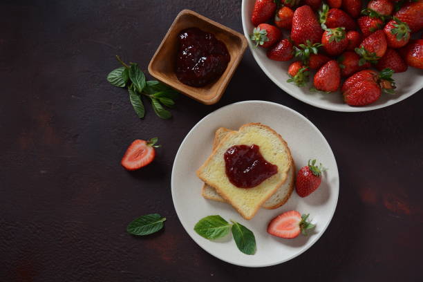 istock Toasts with strawberry jam 1208739117