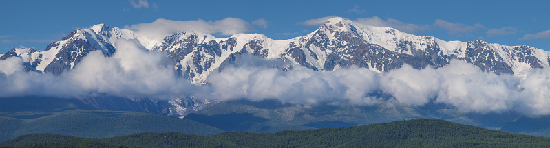 Panoramic view of the mountain range, mountains in the clouds