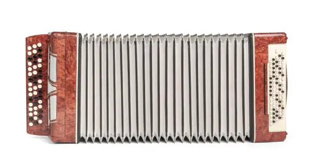 Wide stretched brown button accordion (bayan) isolated on white background. File contains a path to isolation.