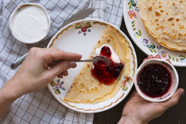 Delicious homemade  crepes with jam stock photo