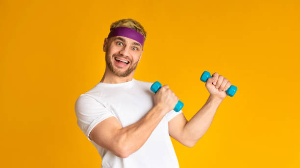 istock Ridiculous guy lifts dumbbells doing morning exercises 1208751715