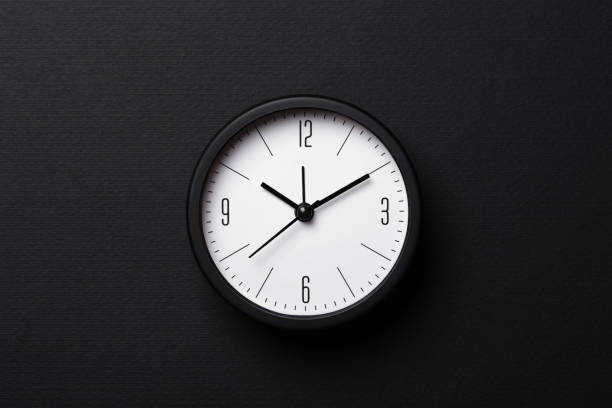 istock Balck Alarm Clock on black background. 1208751816