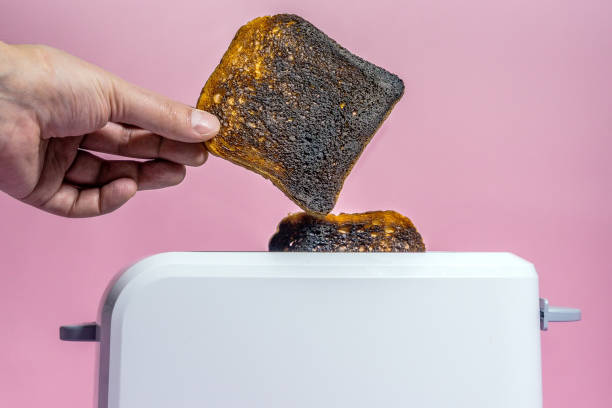 istock burnt bread in the toaster close-up. making toast 1208752790