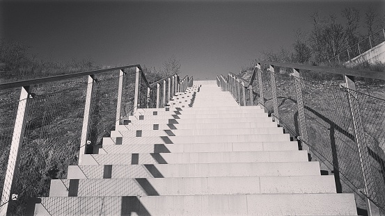 A staircase outside in black and white