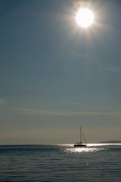istock Yacht Silhouette under the sun 1208756456