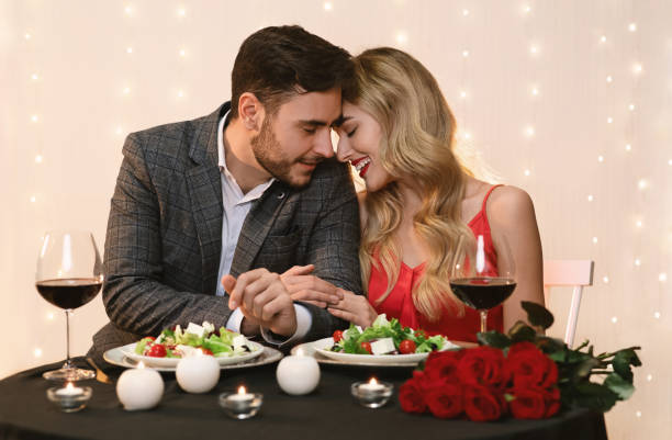 istock Couple in love having romantic dinner in restaurant 1208759101