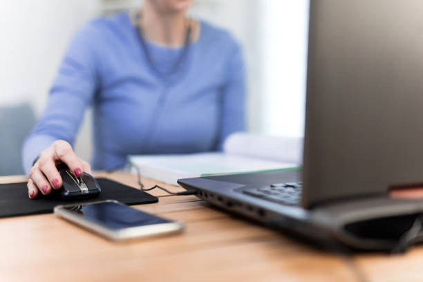 istock Woman using laptop - freelance job, working on a computer. 1208760051