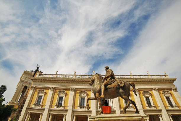 View from below of one of Michelangelo's Capitoline Hill palaces and Roman statue of Emperor Marcus Aurelius on horseback, Rome.