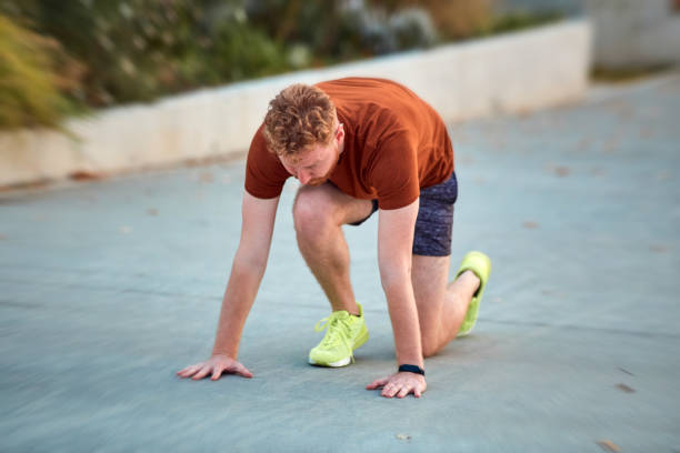 istock Young modern man jogging / exercising in an urban park. 1208760297