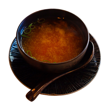 Japanise meal misoshiru erved in the bowl. Isolated over white background