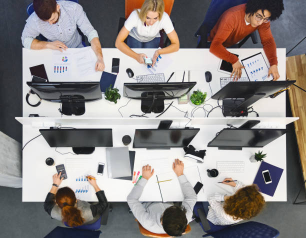 istock Top view of business group working with computers at office 1208760429