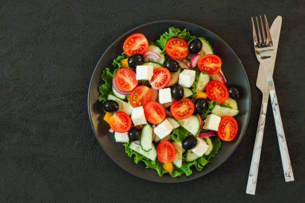 istock Green salad with tomato and fresh vegetables 1208762961