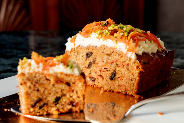 istock carrot cake with topping cream and green pistachio. 1208763500