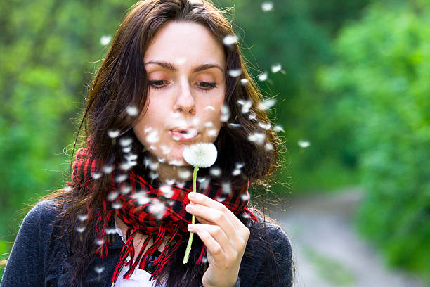 istock Girl with dandelion 120876491